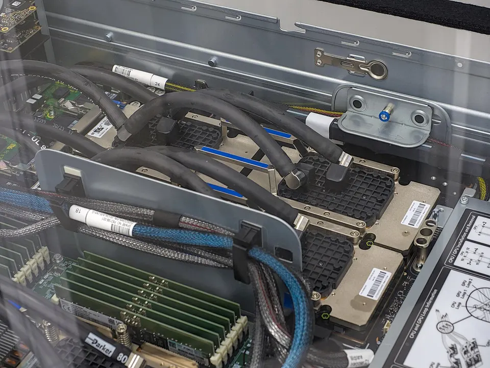 NVIDIA H100 GPU boards inside a supercomputer: the same kind of chip the Evo 2 DNA models were trained on
