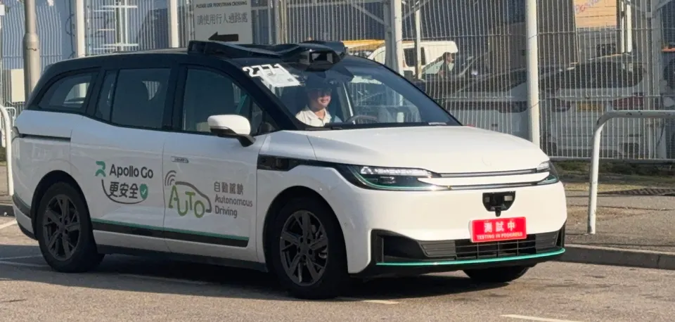 An Apollo Go RT6 testing in Hong Kong (cropped): the car is built around its sensors, with lidar and cameras in the roof line and nose
