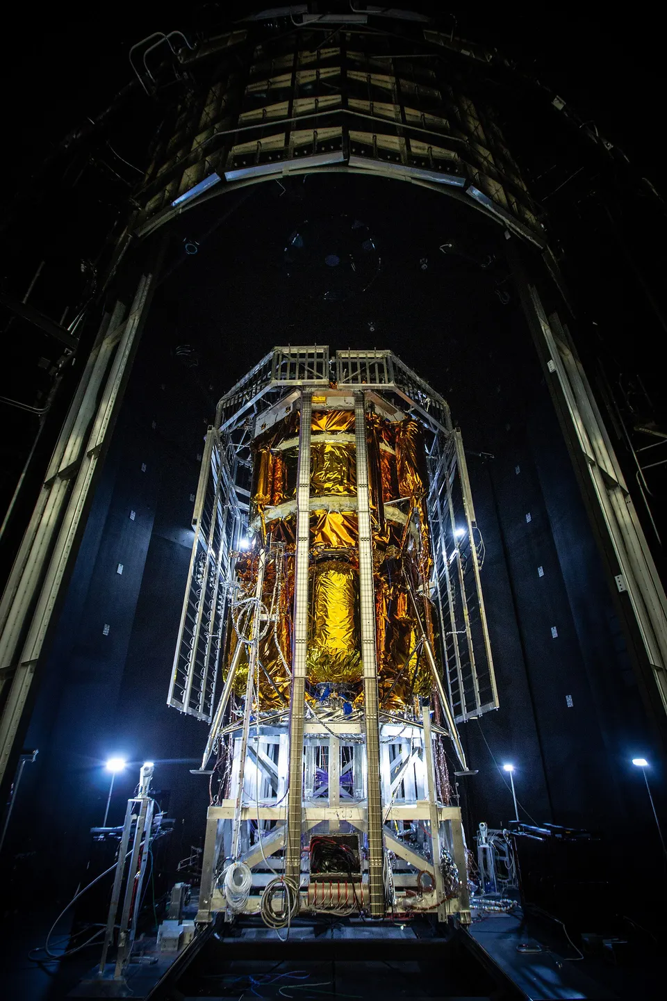 Blue Moon Mark 1 in a NASA vacuum chamber: gold insulation wraps the tanks that must keep hydrogen liquid, with the legs around them