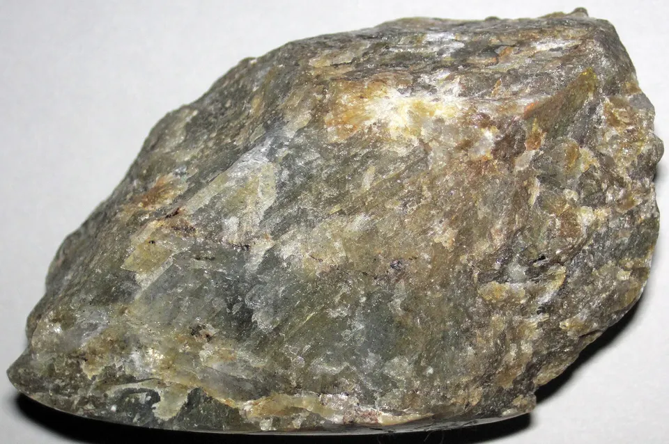 Anorthosite, a calcium-bearing silicate rock with no carbonate in it: rocks of this kind replace limestone as Brimstone's source of calcium