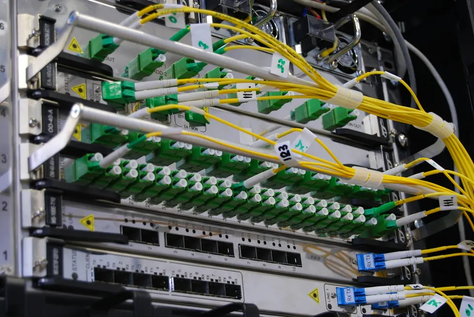 Fibre-optic cables in a network switch: Chainlink nodes watch one chain and relay committed messages to another over links like these
