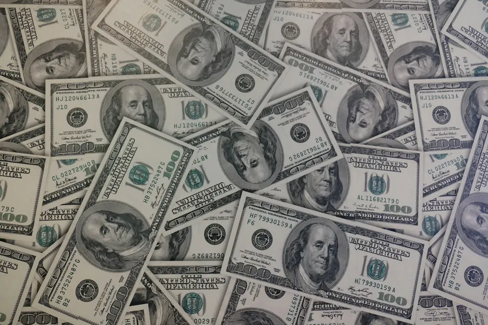 US hundred-dollar notes: every USDC is backed by a dollar held in cash or short-term Treasuries, and redeeming burns the token