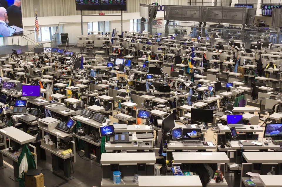 Trading floor in Chicago's Board of Trade building: futures exchanges with a clearinghouse in the middle, like Coinbase Derivatives