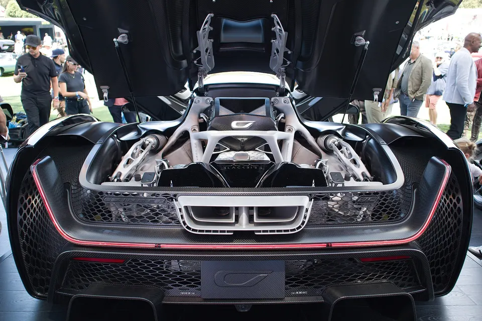 Rear of a Czinger 21C, engine cover open: the silver, bone-like frame parts around the engine were printed and joined by Divergent's system