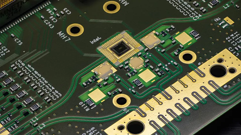 The Tunnel Falls chip (centre) mounted on its board, wired to the lines that bring control signals in from outside the fridge