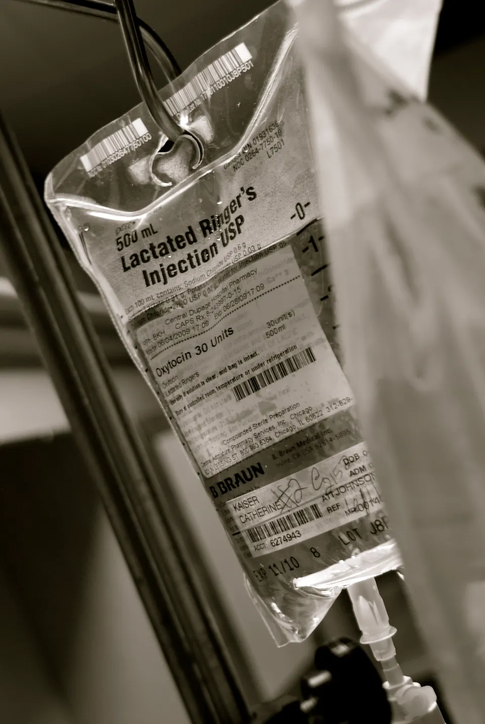 An IV drip bag and line: lonvo-z is given once, as a drip like this, and the liver takes up the editor from the blood