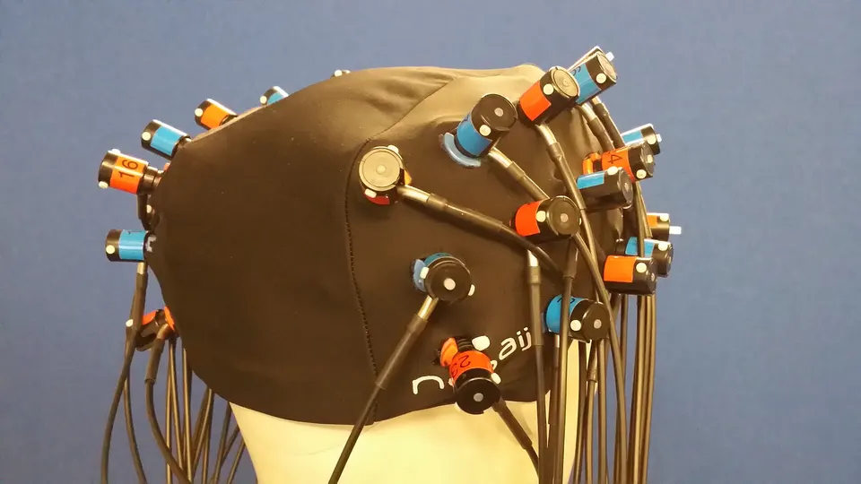 An older light-based (fNIRS) cap on a model head: emitters and detectors on the scalp track blood oxygen, the principle behind Kernel Flow