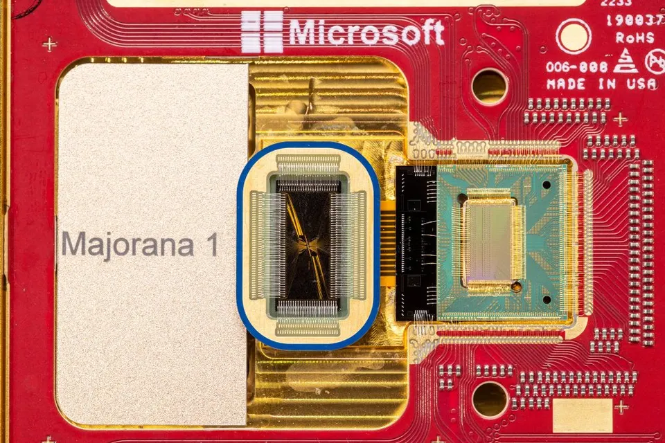 Majorana 1 up close: the quantum chip (ringed in blue) sits beside a second chip, both wire-bonded onto a gold-plated mount