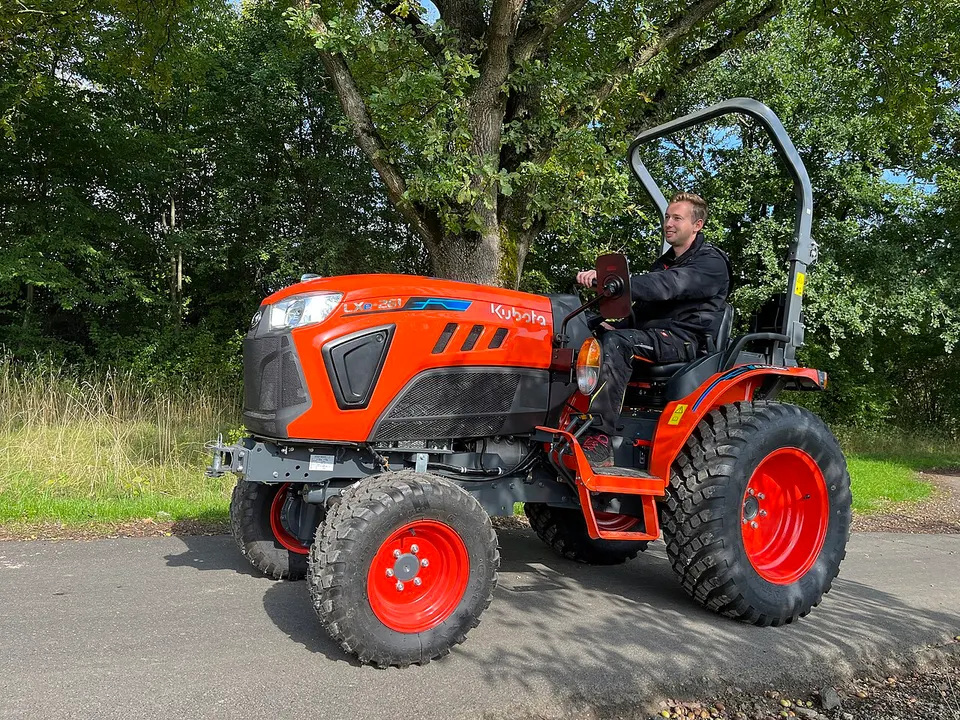 A compact battery-electric tractor (Kubota LXe): the same electric-drive idea as the MK-V, which adds cameras so it can work without a driver