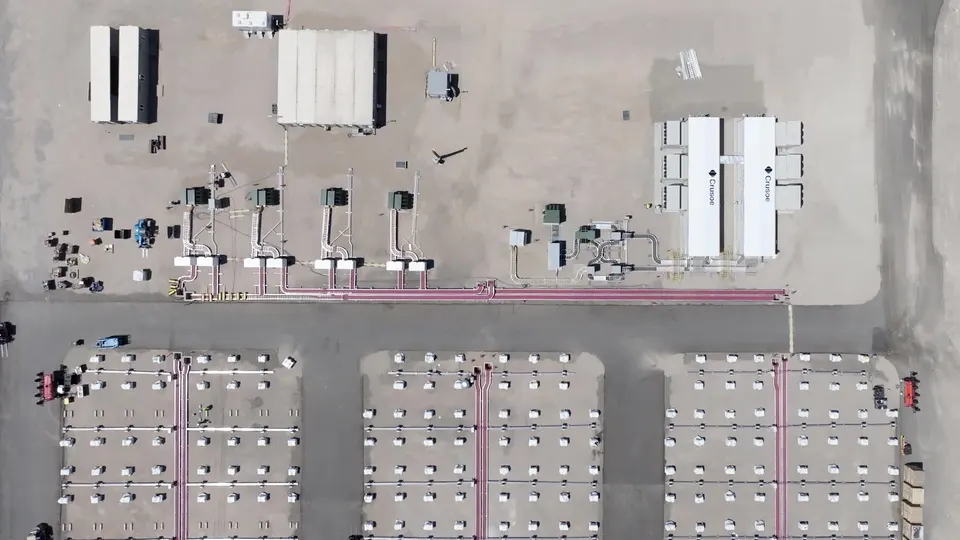 Rows of used EV battery packs feeding Crusoe's modular data centres at Redwood's Nevada microgrid, seen from above