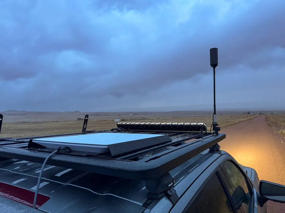 A Starlink flat-panel dish on a truck roof: an electronically steered antenna that follows satellites across the sky with no moving parts