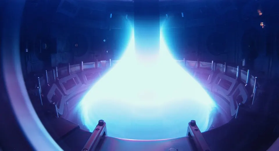 Plasma glowing inside MAST, a UK spherical tokamak: the same apple-core shape as ST40