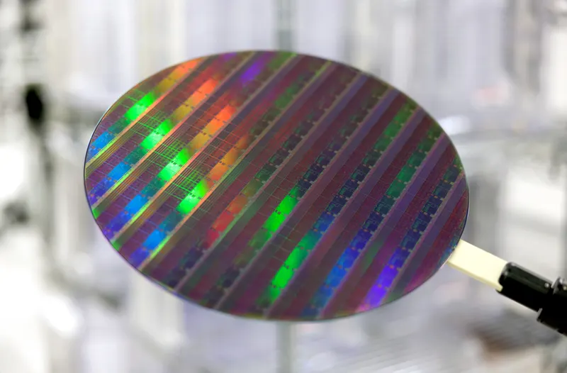 A 300 mm wafer patterned by an ASML scanner, not an N2 wafer: every N2 chip is built up on such a wafer, layer by layer