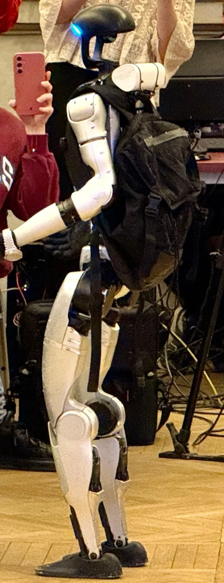 A Unitree G1 from the side (cropped): Unitree's own motors sit in the round housings at hip, knee and shoulder; the head holds the lidar