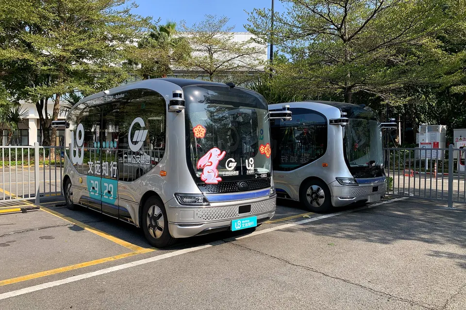 WeRide Robobuses in Guangzhou, with sensors on every corner: the same driving software as WeRide's robotaxis, tuned to a bus