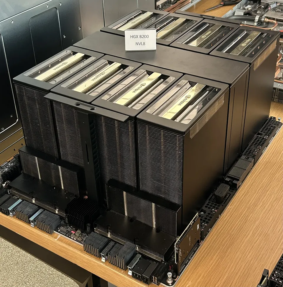 An NVIDIA HGX board with eight GPUs under their heatsinks: Colossus's servers are built from boards of this kind