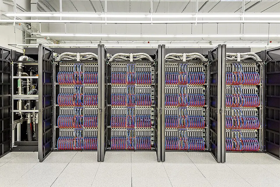 Open cabinets of GPU compute blades (the Alps supercomputer in Switzerland): Grok is trained on racks of this kind in Colossus