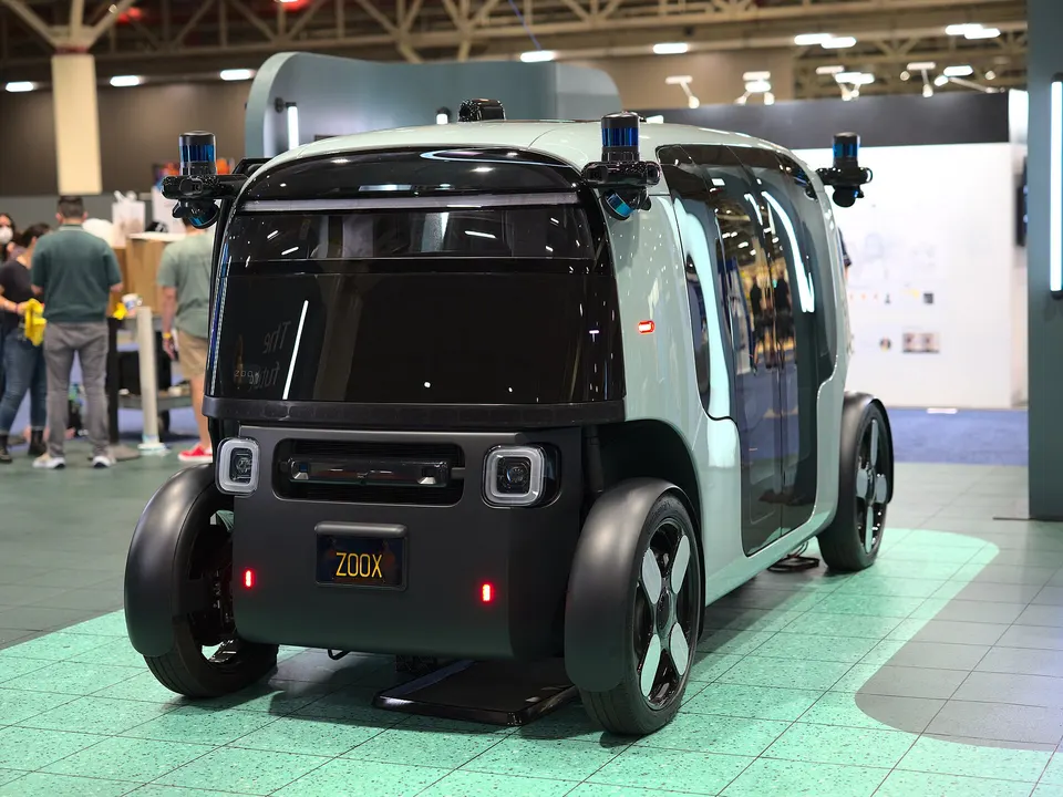Zoox from the end: sensor pods on all four corners, and no front or back, so it can drive either way